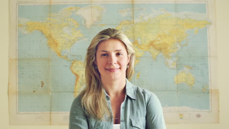 Young-tourist-travel-woman-portrait-world-map-background